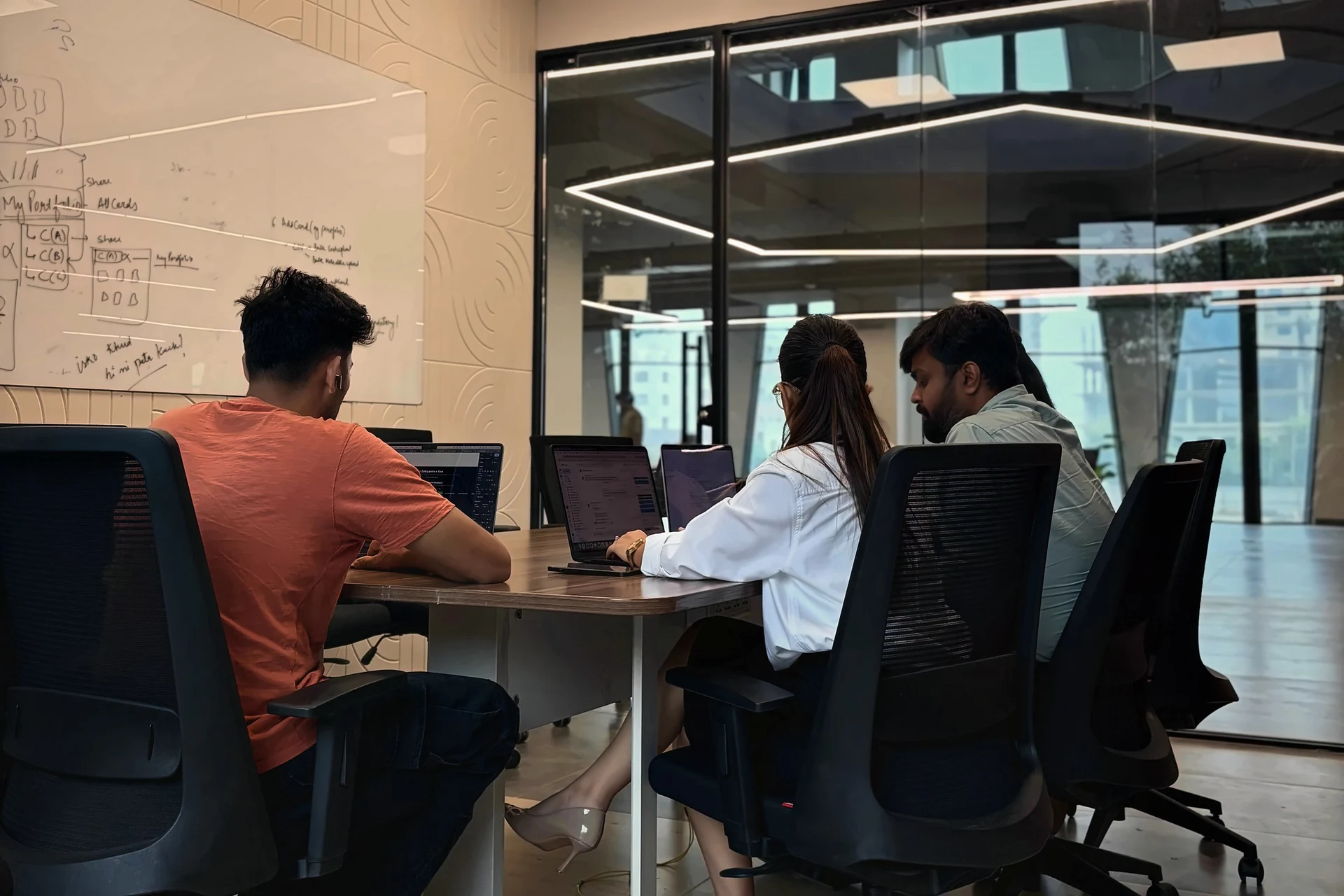 A working session by the whiteboard wall
